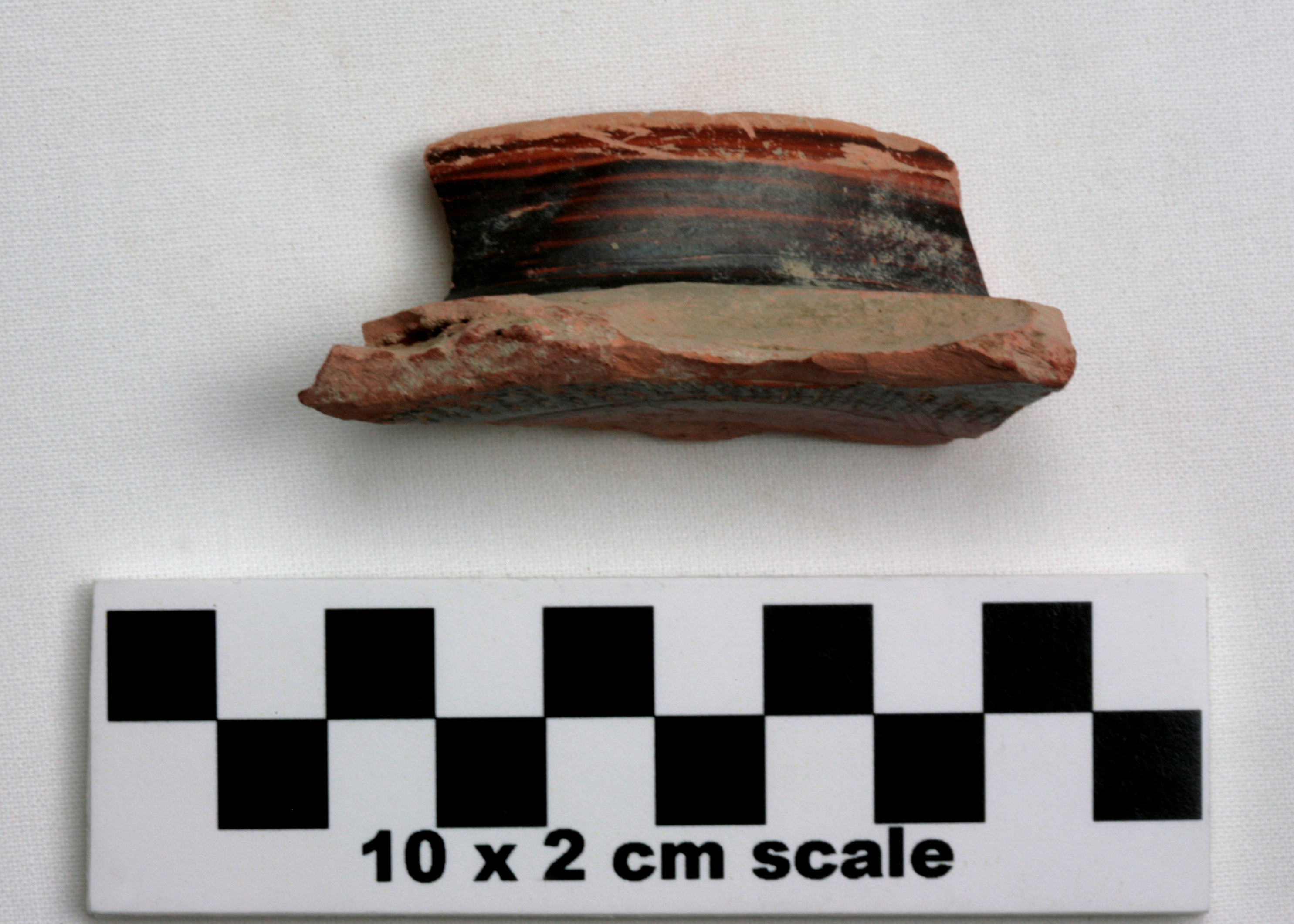 Image of item of type Pottery and color Light reddish brown