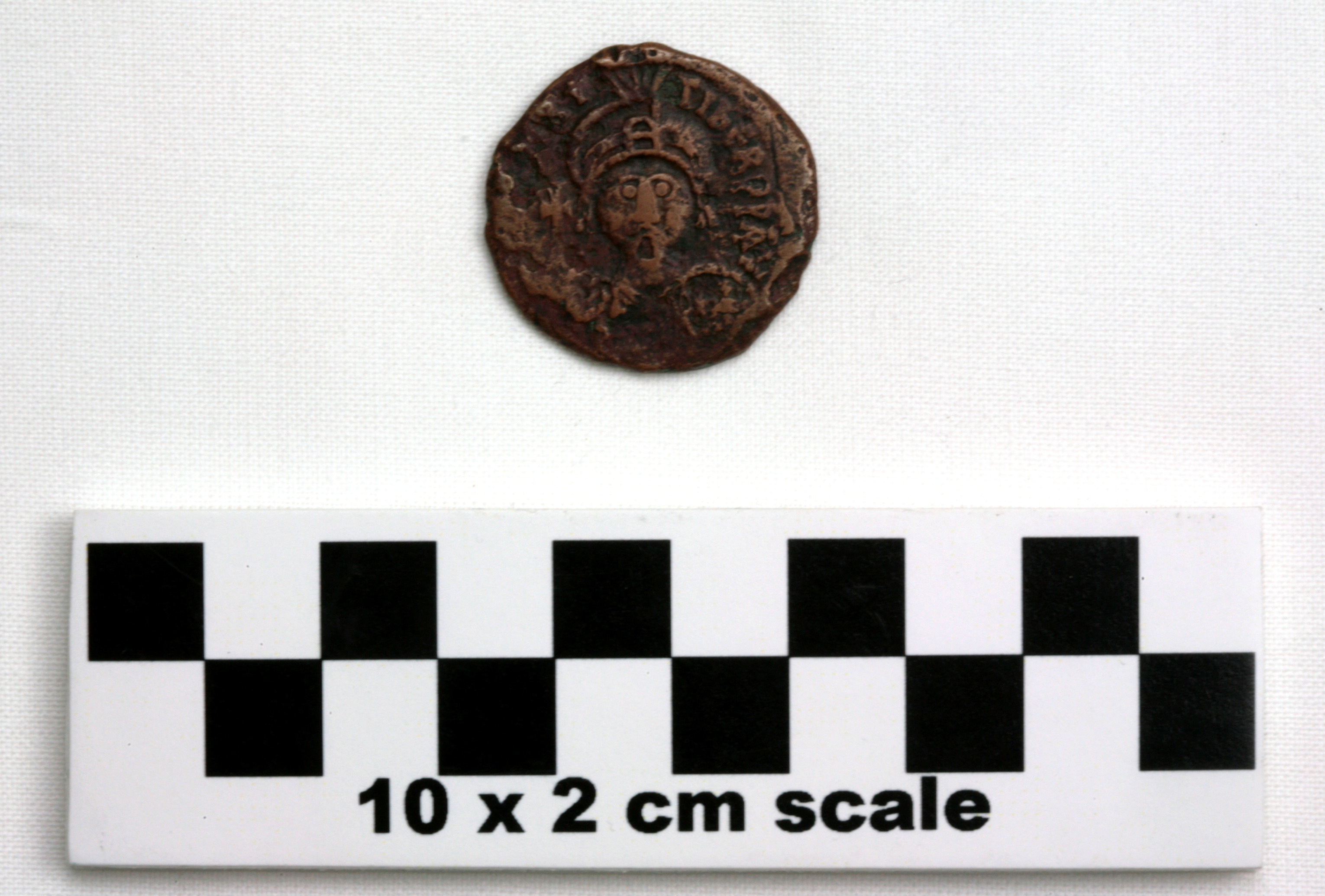 Image of item of type Coin and color black, corrosion-grayish green, red