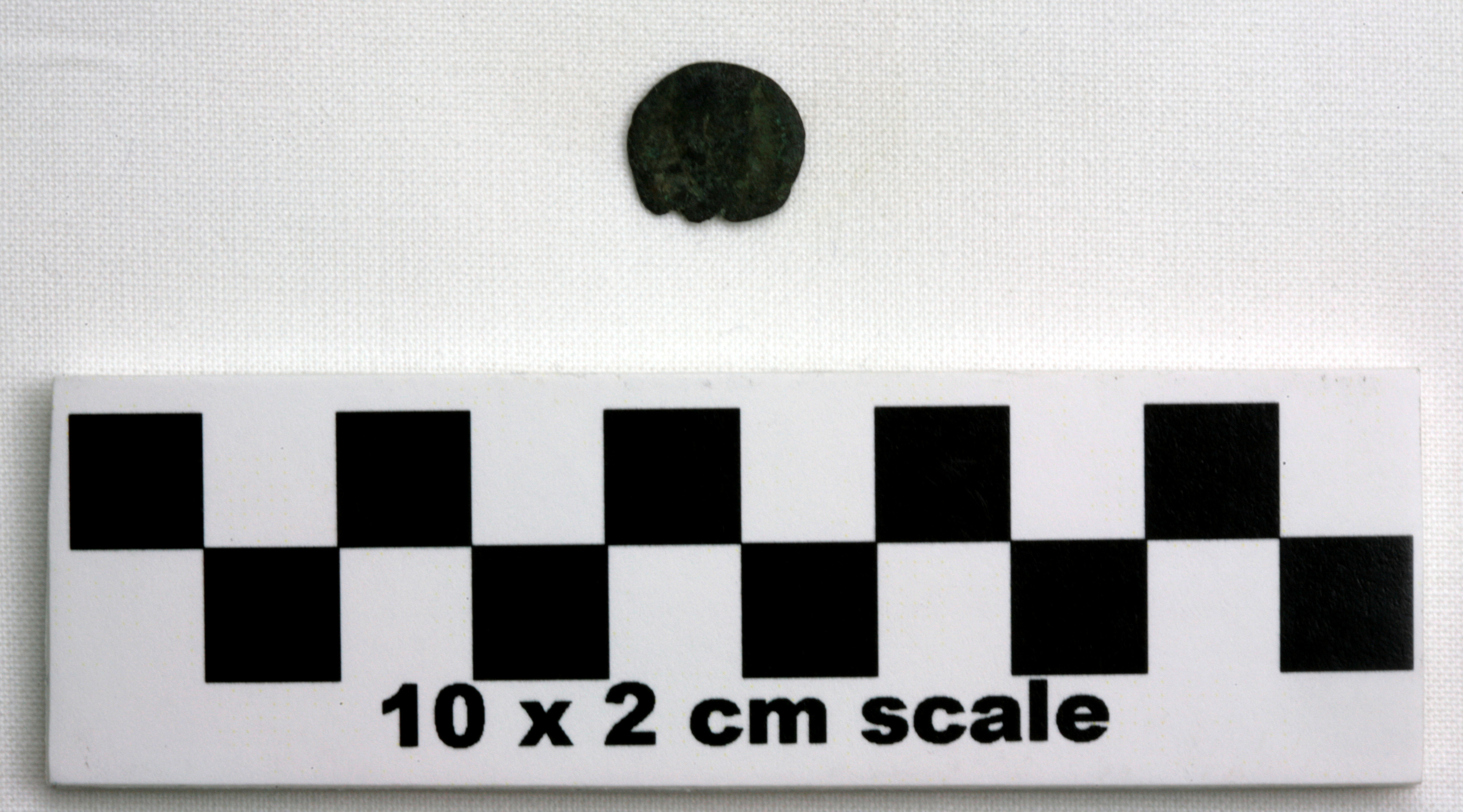 Image of item of type Coin and color black, corrosion-grayish green