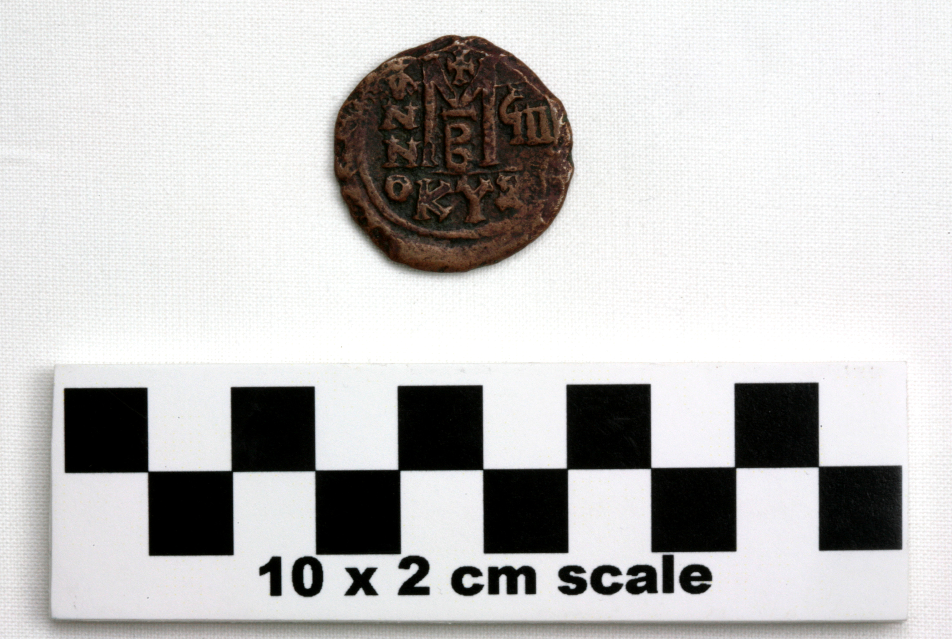 Image of item of type Coin and color black, corrosion-grayish green, red