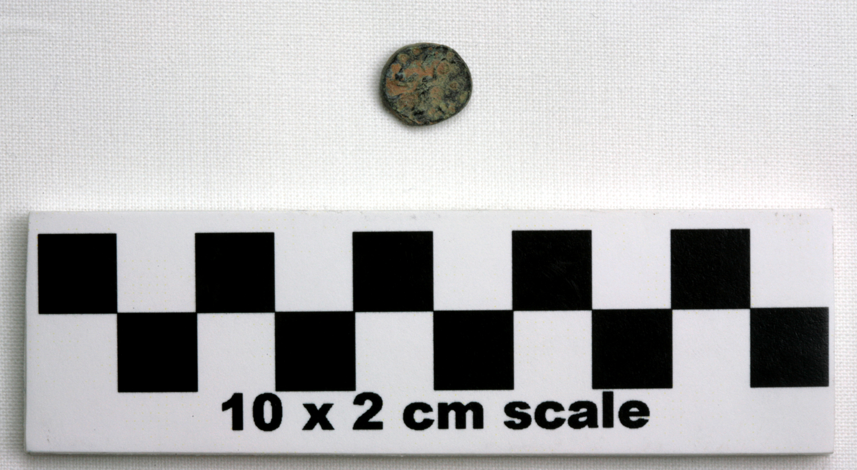 Image of item of type Coin and color black, corrosion-pale green, light red
