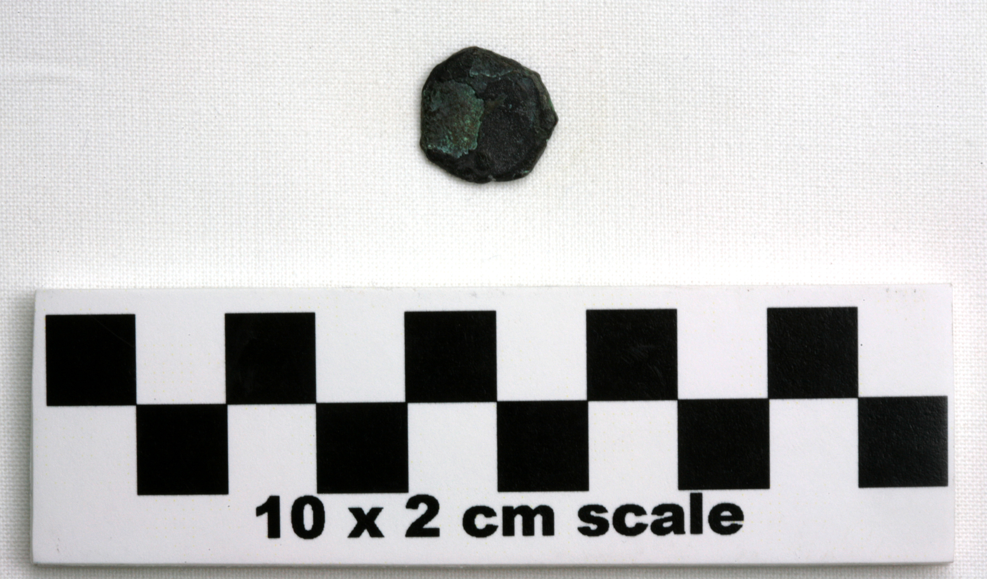 Image of item of type Coin and color black, corrosion-dark brown, pale green