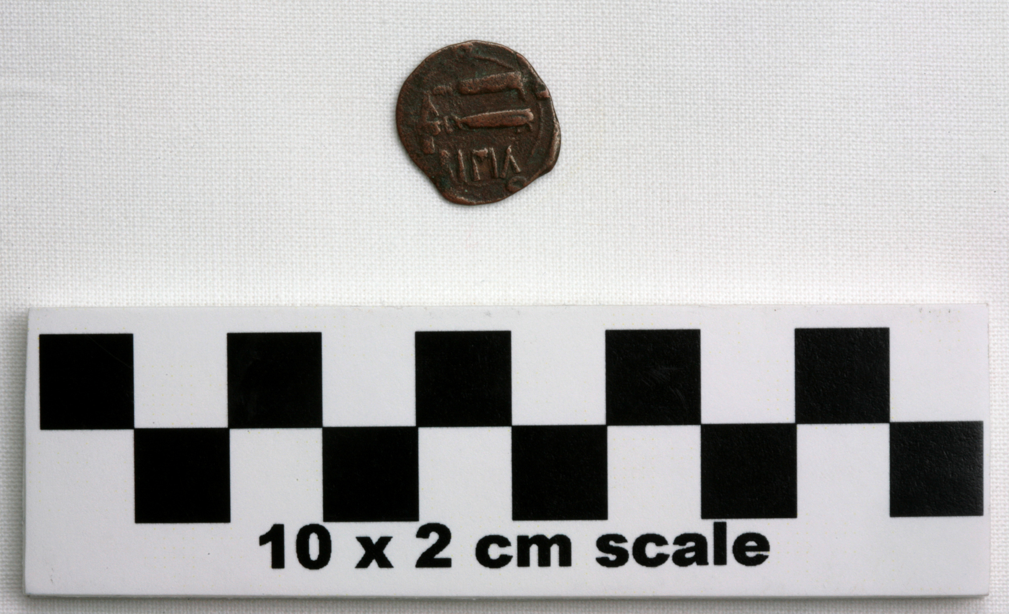 Image of item of type Coin and color darkened bronze, very dark gray, pale green