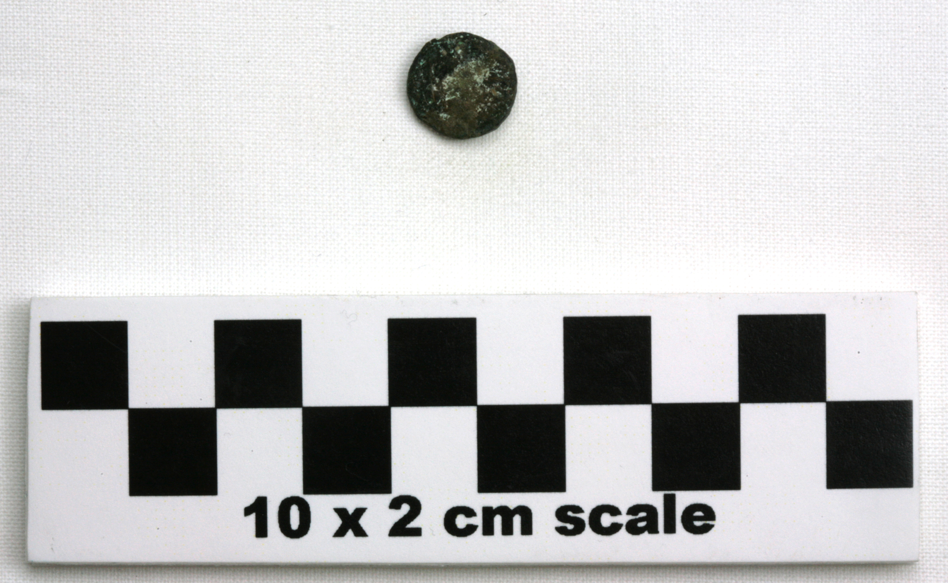 Image of item of type Coin and color black, corrosion-olive, white, pale green