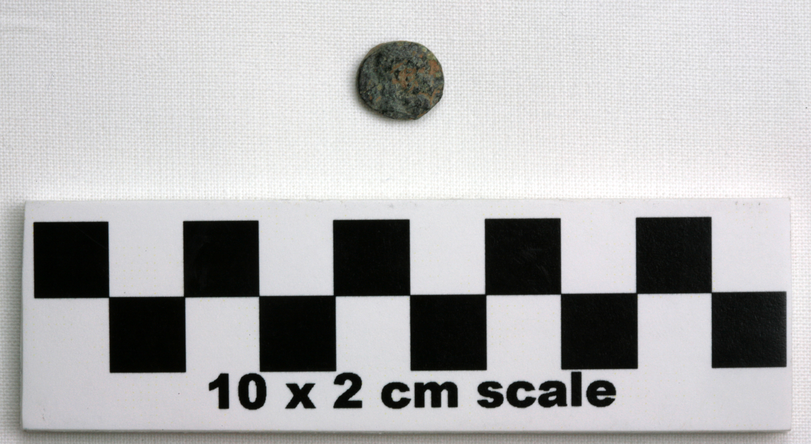Image of item of type Coin and color black, corrosion-pale green, light red