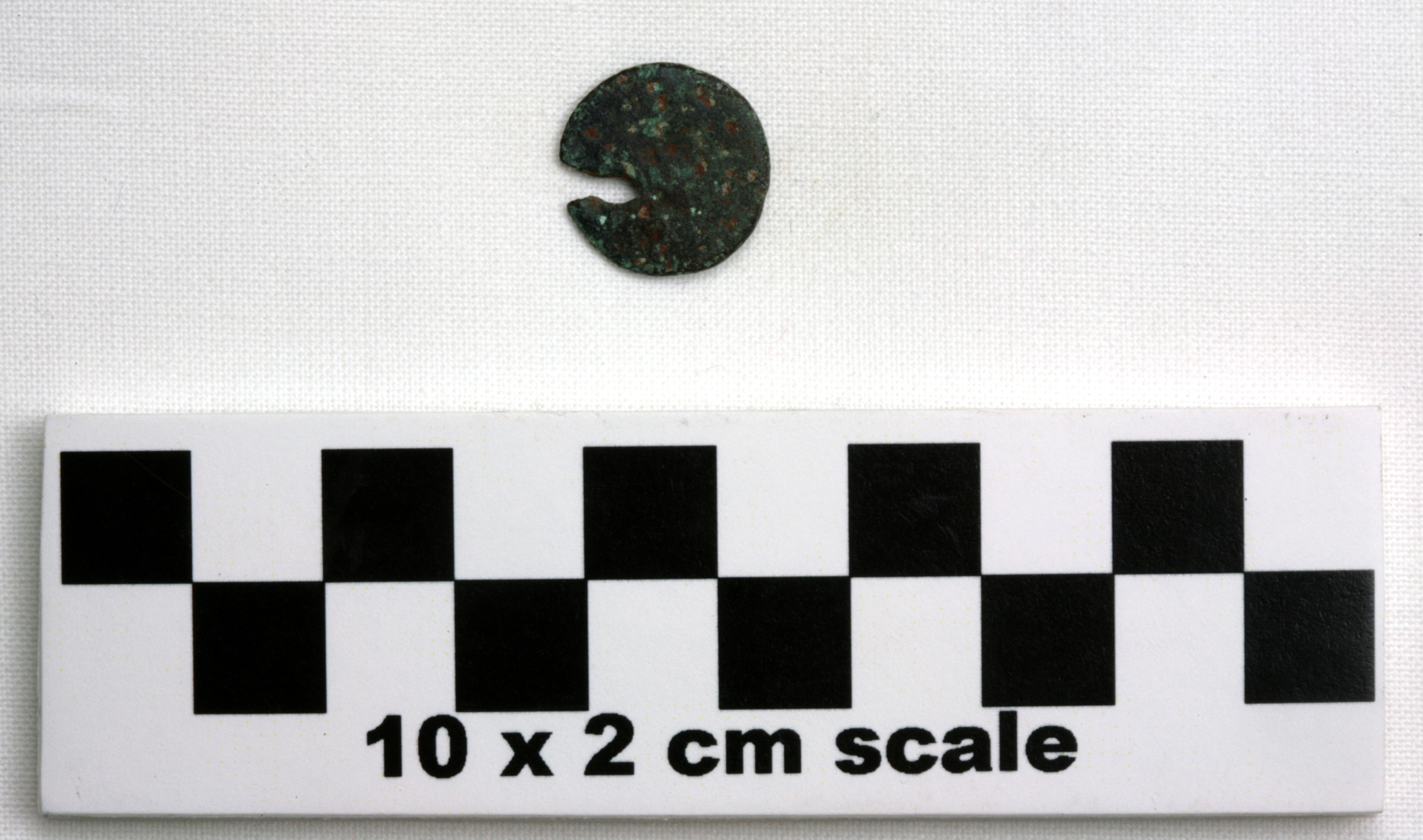 Image of item of type Coin and color black, corrosion-grayish green, red