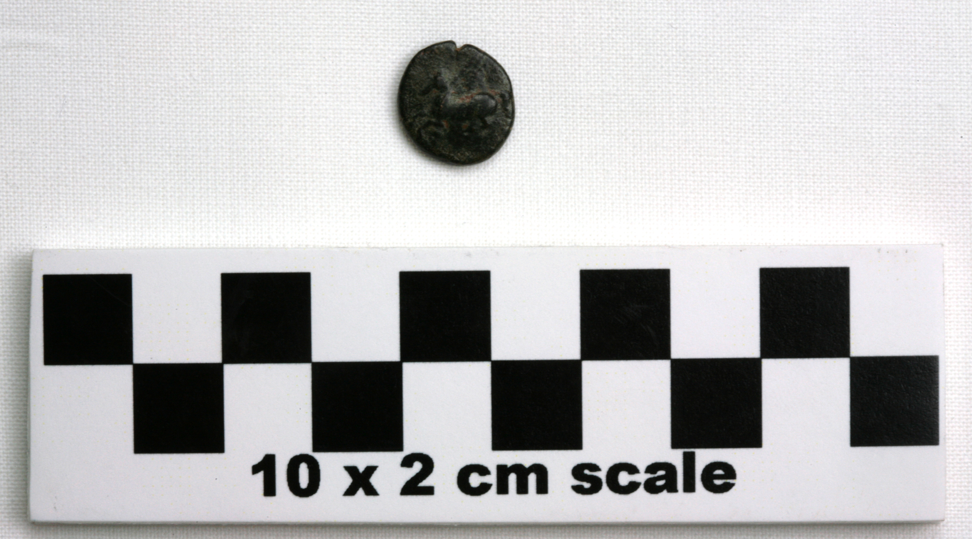 Image of item of type Coin and color black, corrosion-dark greenish gray,red