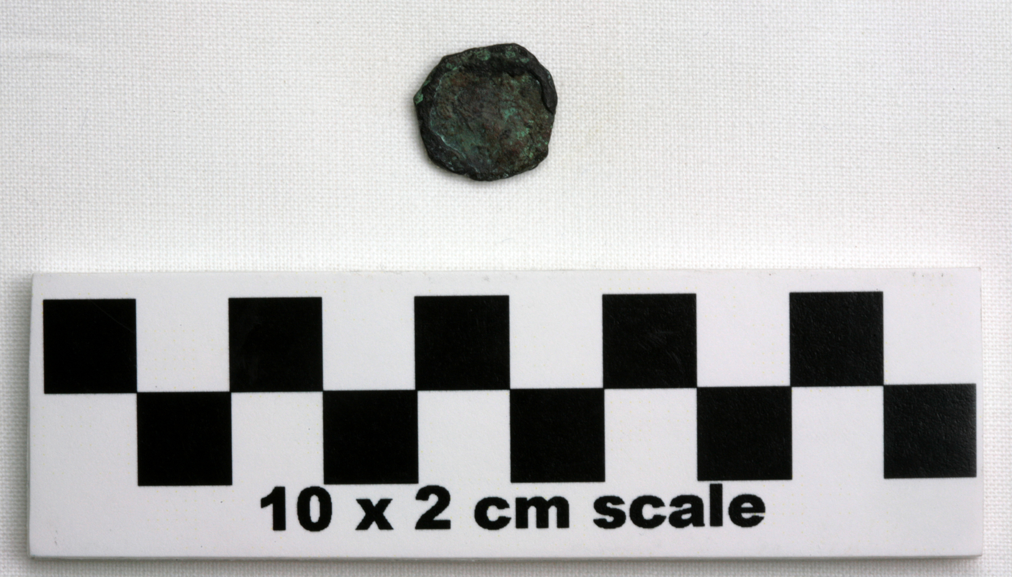 Image of item of type Coin and color black, corrosion-dark brown, pale green